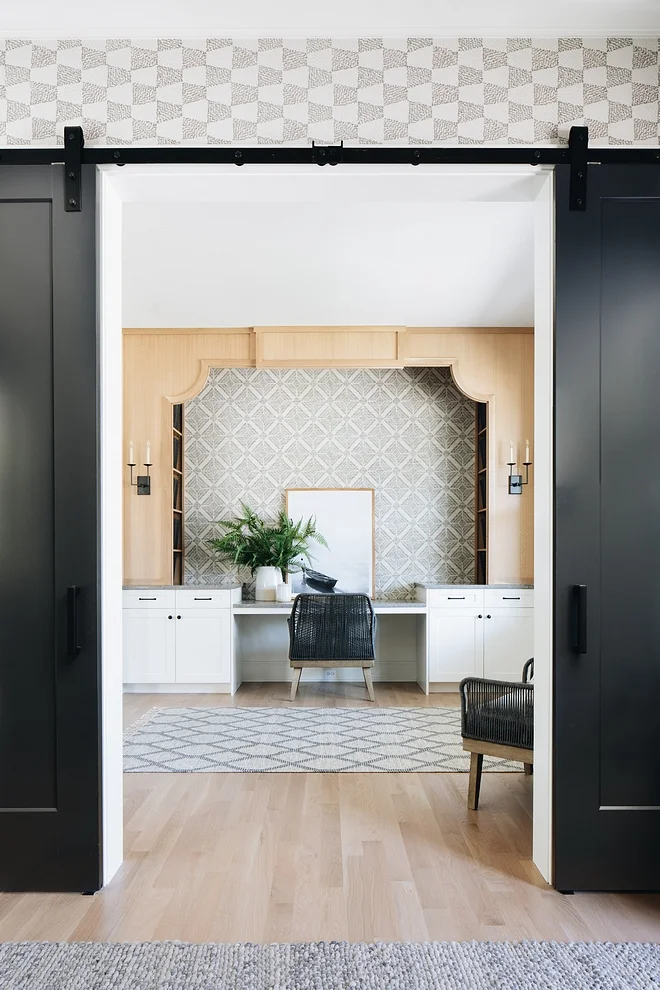 The wallpaper is a printed grasscloth from Thibaut.