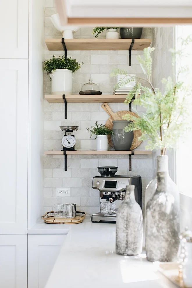 Backsplash is Carrara Marble in honed tile