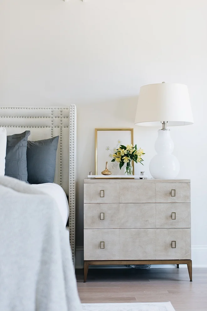 The bedroom wall paint color is Benjamin Moore Classic Gray. Nightstands are from Walter e Smith