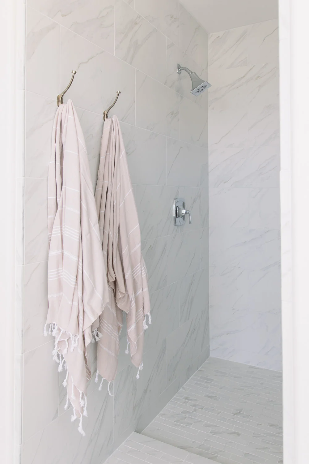 The tile in the master bathroom reflects the theme of water, as well, with the ripples in the marble.
