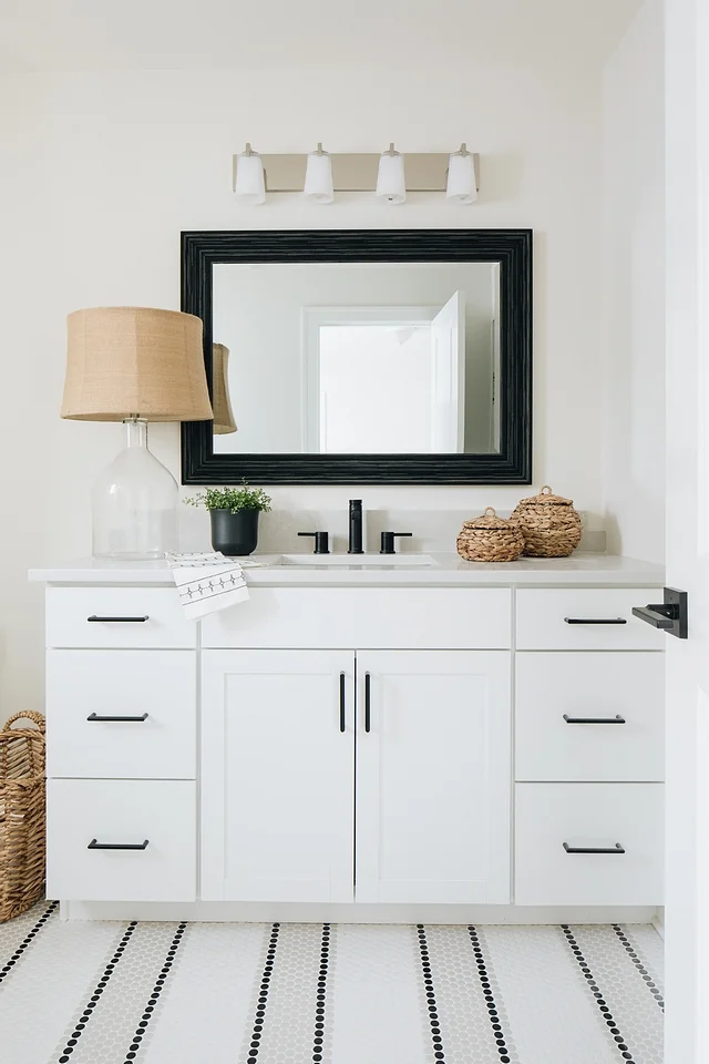 This bathroom goes bold with only black and white, very different from the rest of the home yet powerful.