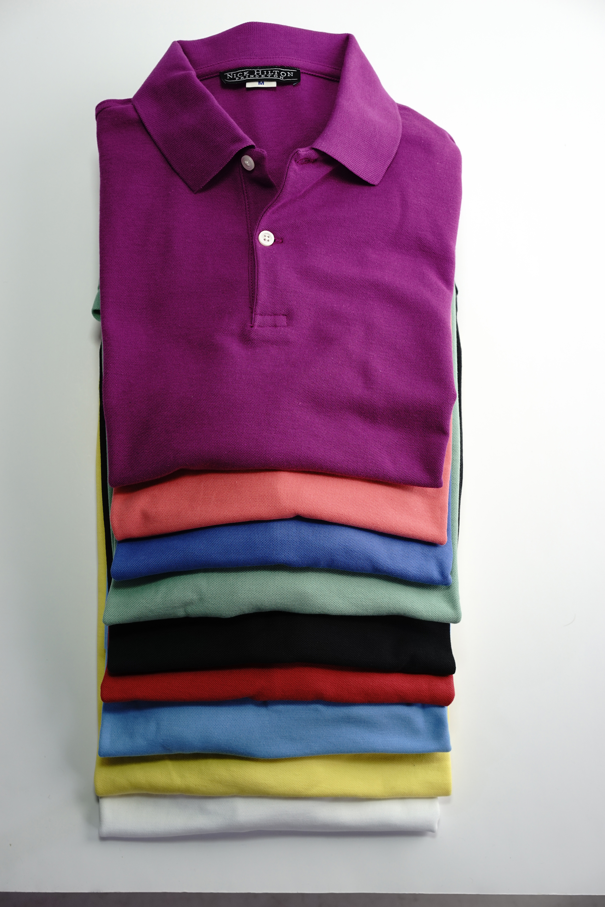 The Nick Hilton polo shirt comes in 9 colors and two fits: trim and classic.