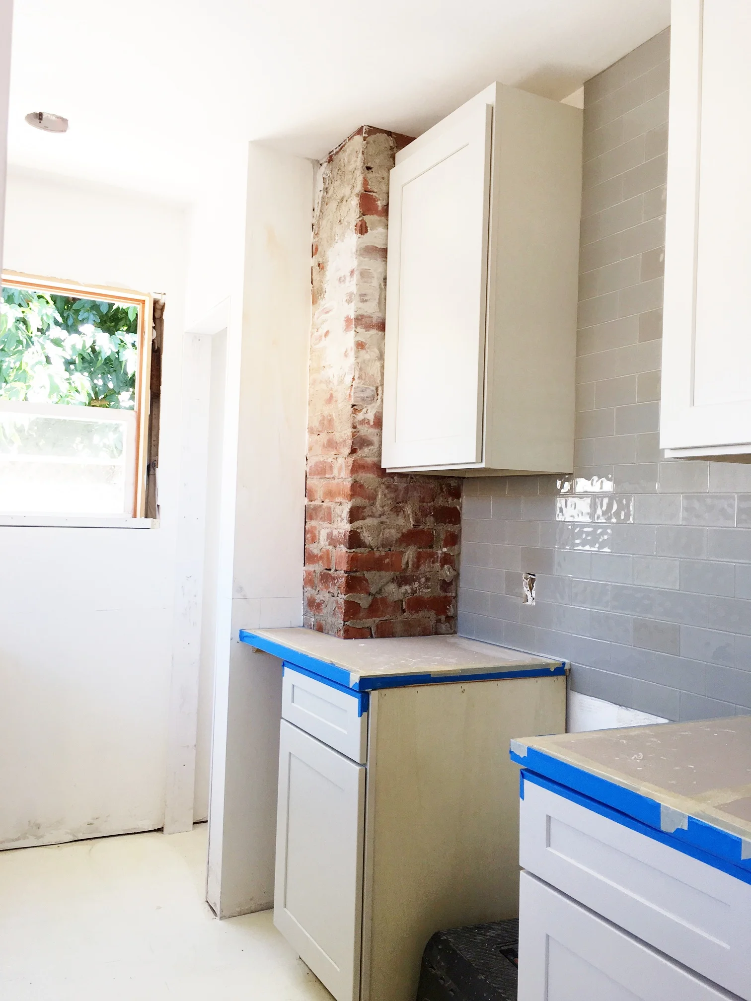 Here's a shot of the other side of the kitchen. We kept the used brick from the furnace exposed.