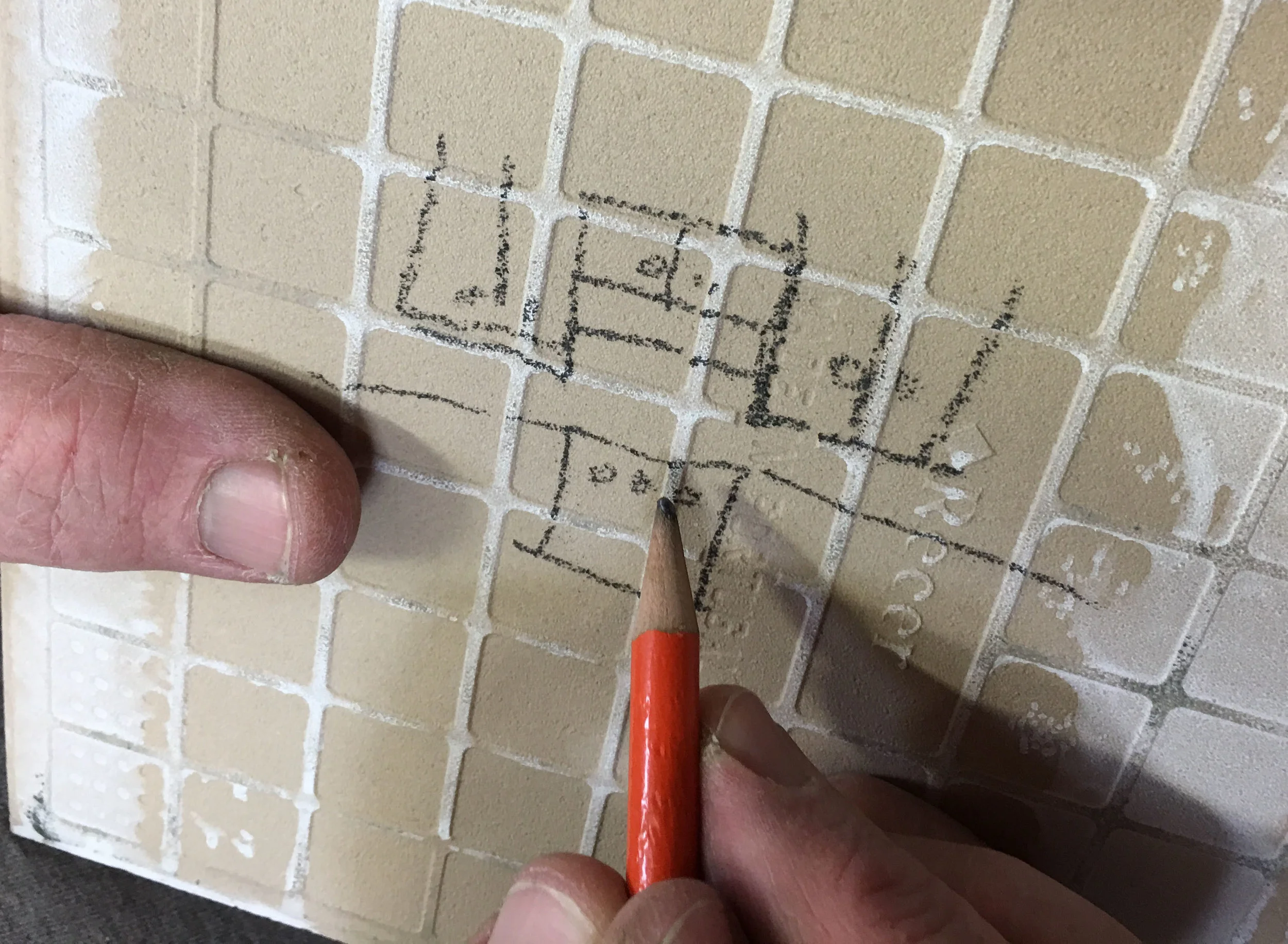 Here's Lance sketching our cabinet config prior to ordering.