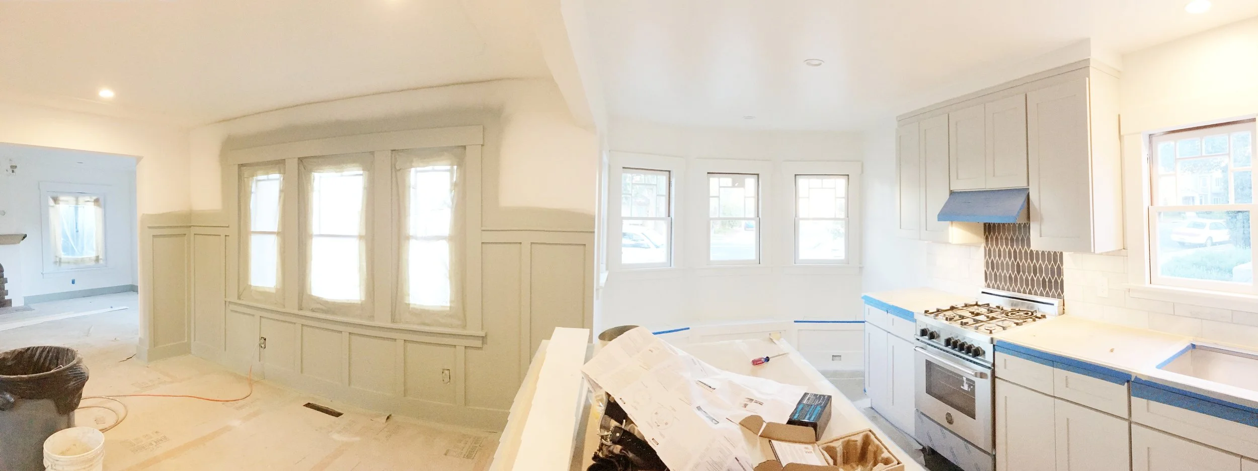 Here is a pano shot of the lower level. You can see the trim sprayed on the dining room wall.