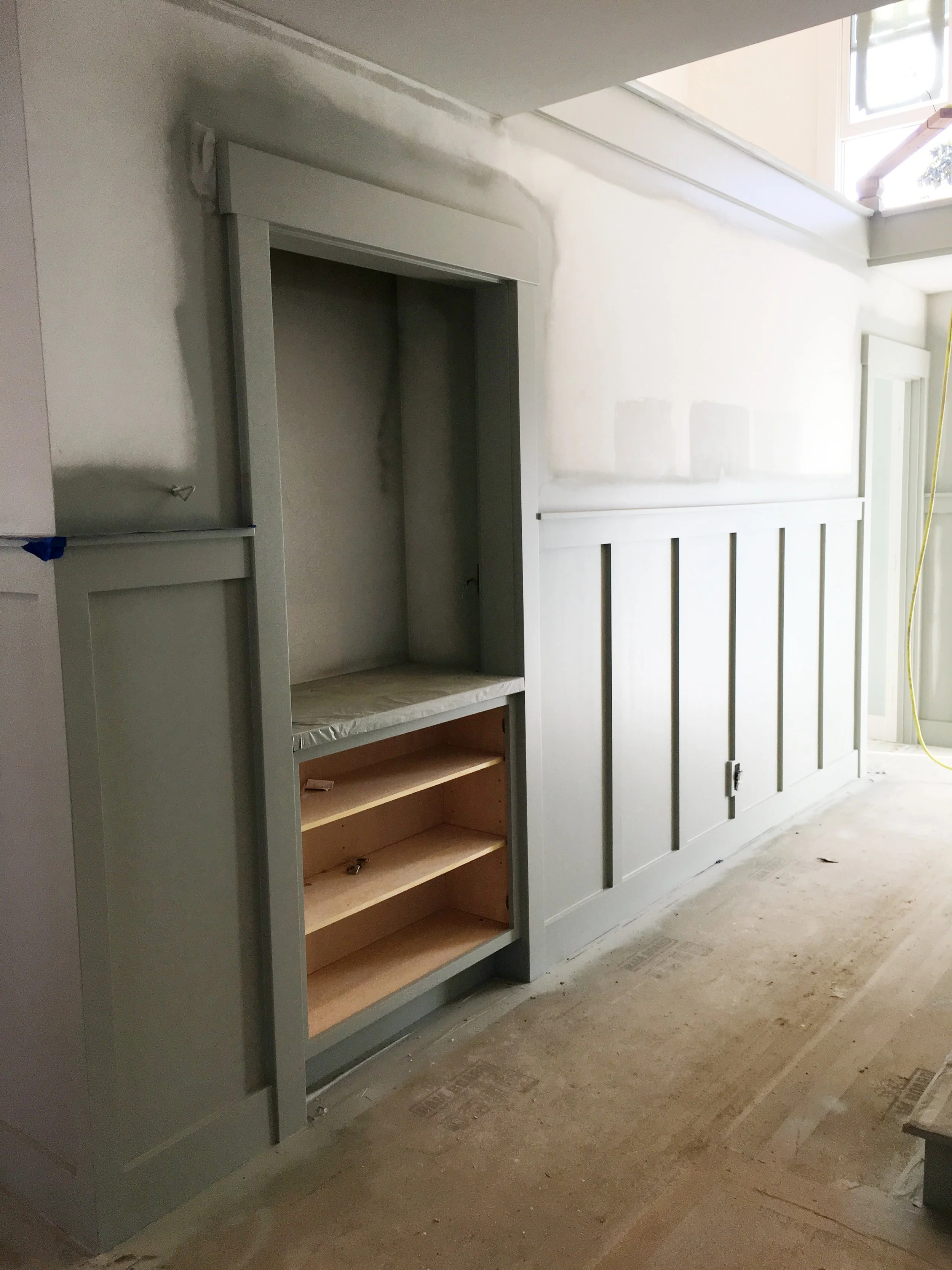 This is the wainscotting that just got its final coat of paint. The satin finish is divine. I just want to touch it. 