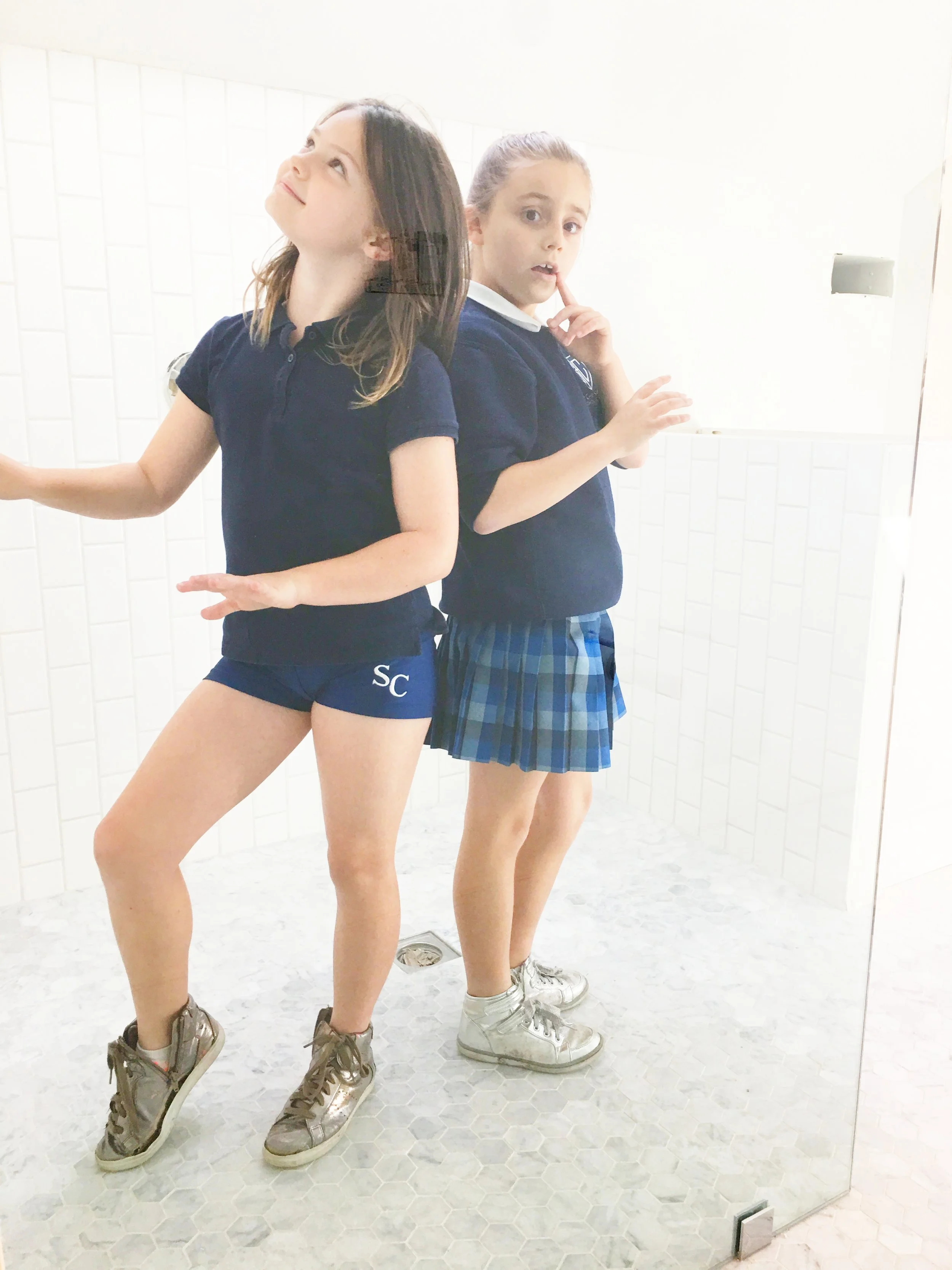 This is Lucy and her friend, Capri, voguing in the master bathroom. By the way, for anyone who remembers (and was worried for me), we fixed the carrera floor issue. Huge headache. Huge relief.