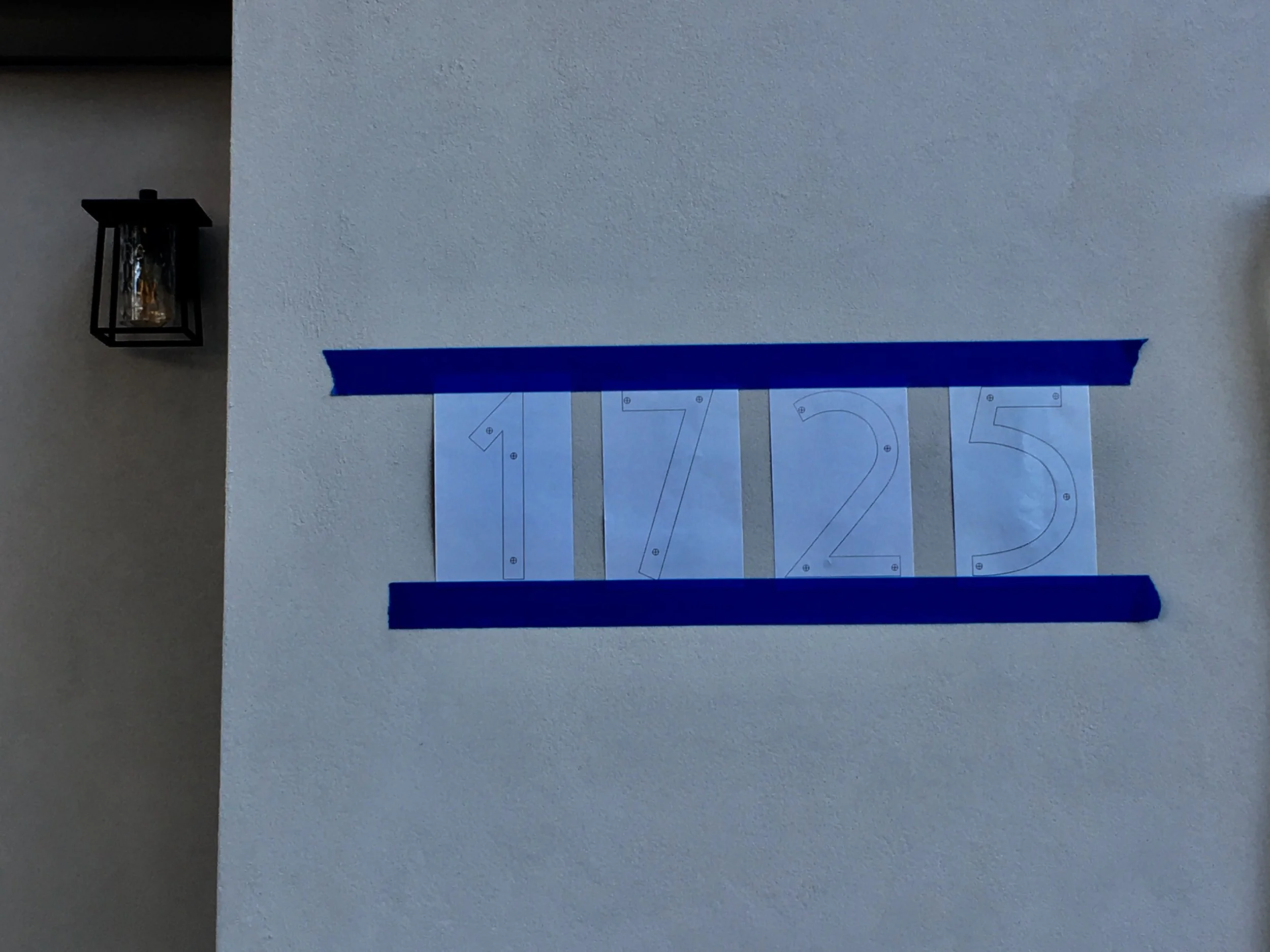 The final touch. I jumped the gun because this is the stuff I love. But then Lance got tied up and the tape fell off the wall. LOL. Hopefully, the next time you see the house, the actual numbers, not just the template, will be up.