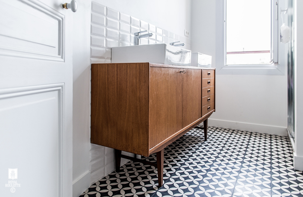 If you recall, we purchase two 1920's vanities for each of the bathrooms in the main house. The guest bath is getting an above-the-counter sink (like you see above). The master is getting a trough sink. Below, you see David cutting into the top of the vanity (eeeek, it hurts me) in order to retrofit the sink and the plumbing (not an easy task).
