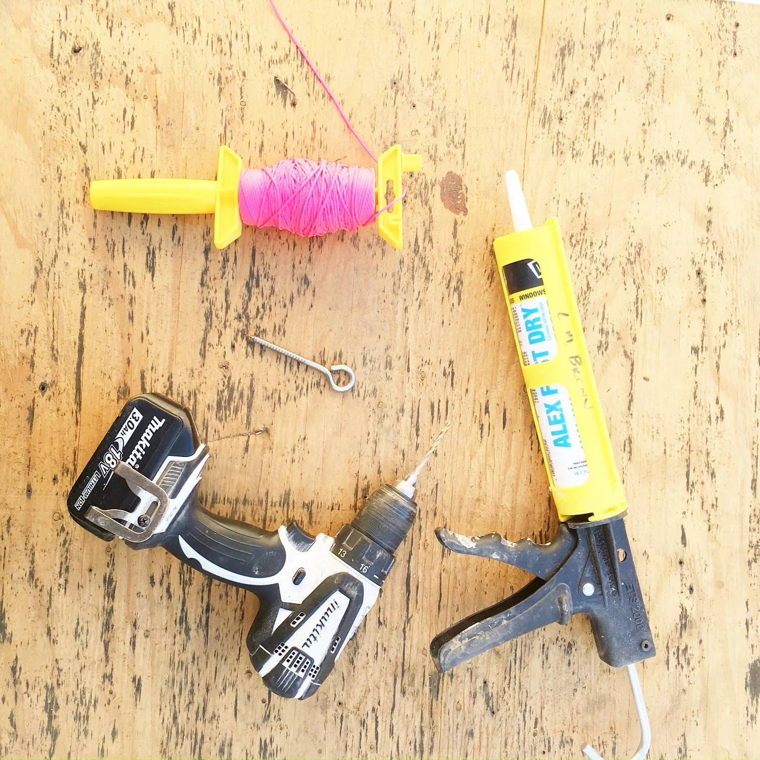 Drill, large eye hooks, caulking and caulking gun, ball of string (to create a level base line).