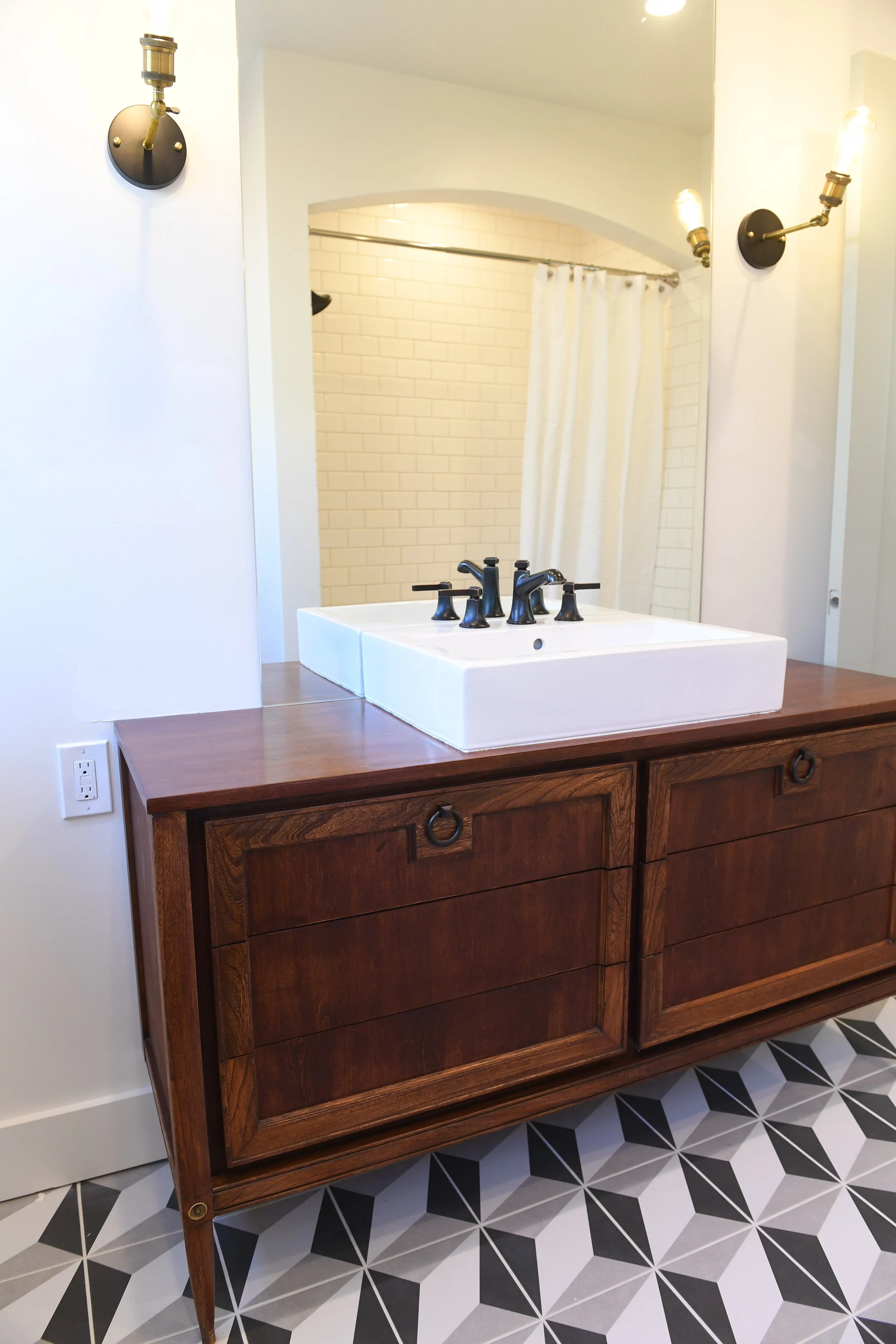 Here's where you can get a similar sink , faucet or these fabulous floor tiles.