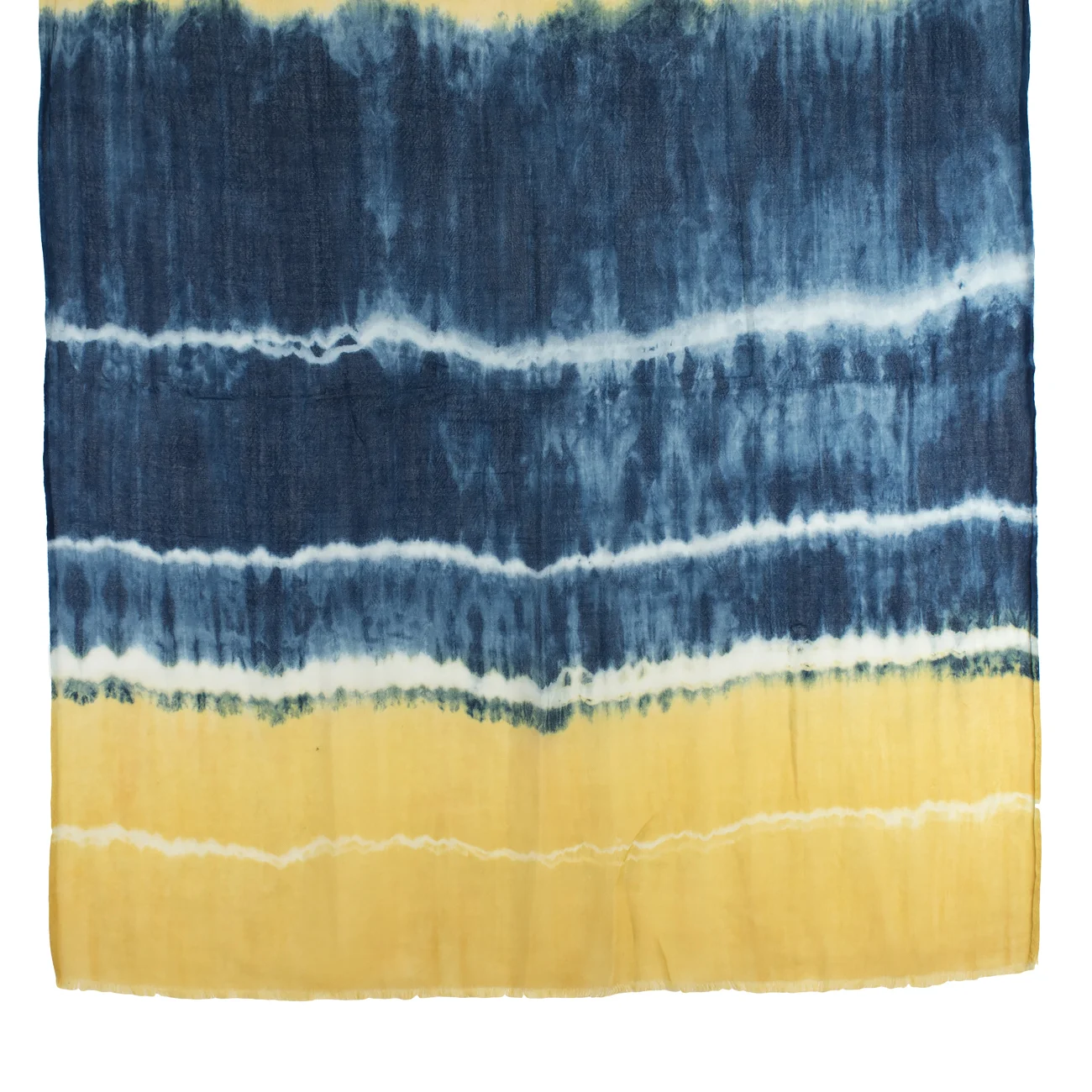 Our Tie Dyed shawl is made from indigo and botanical dyes
