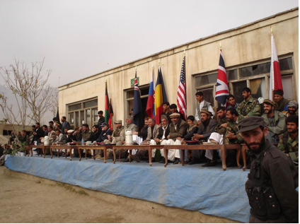 Afghan dignitaries and a U.S. colonel share a table with a prime view of the action. (Photo courtesy: Josh Walters)