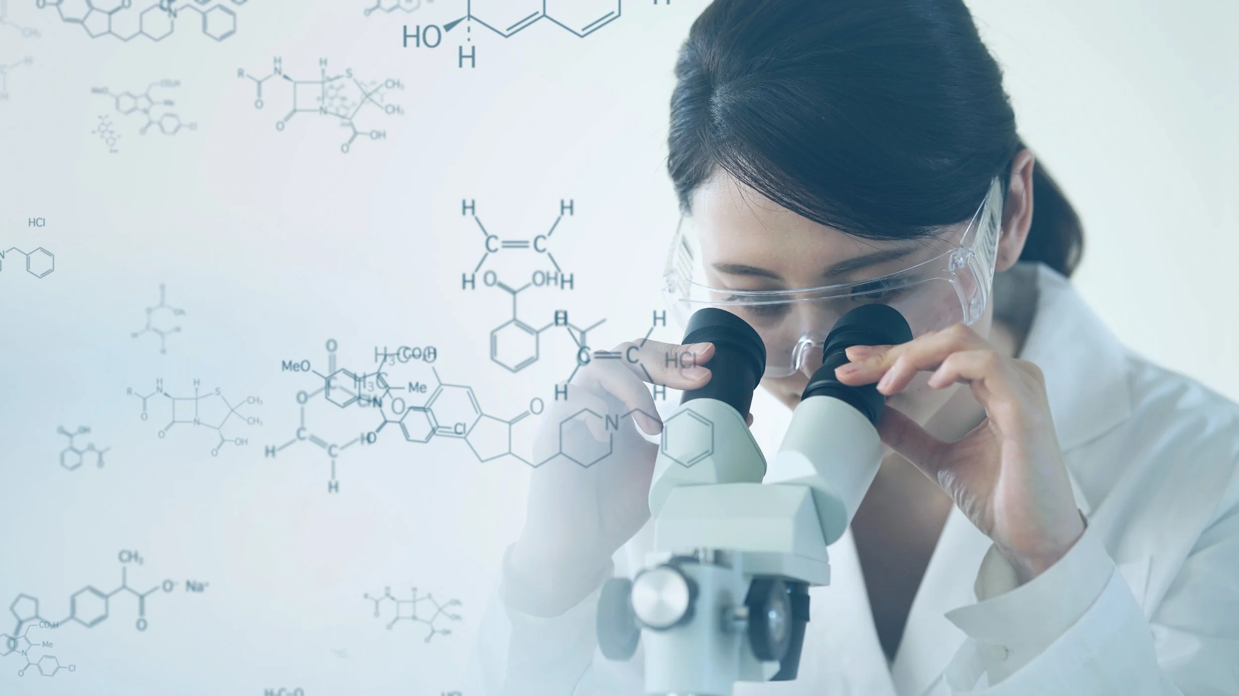 A female scientist wearing safety glasses looking through a microscope with chemical formulas and structures overlayed in the background.