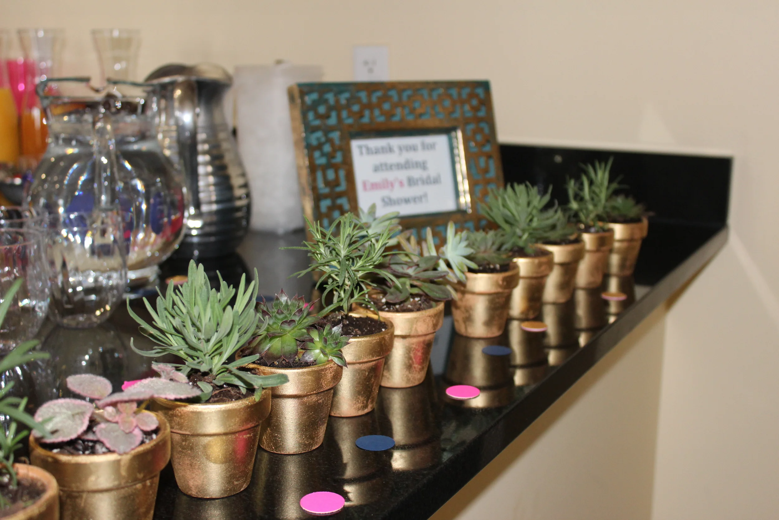 Aren't these the cutest! Liz sprayed painted them and potted fun succulents and herbs for each attendee to take with them.
