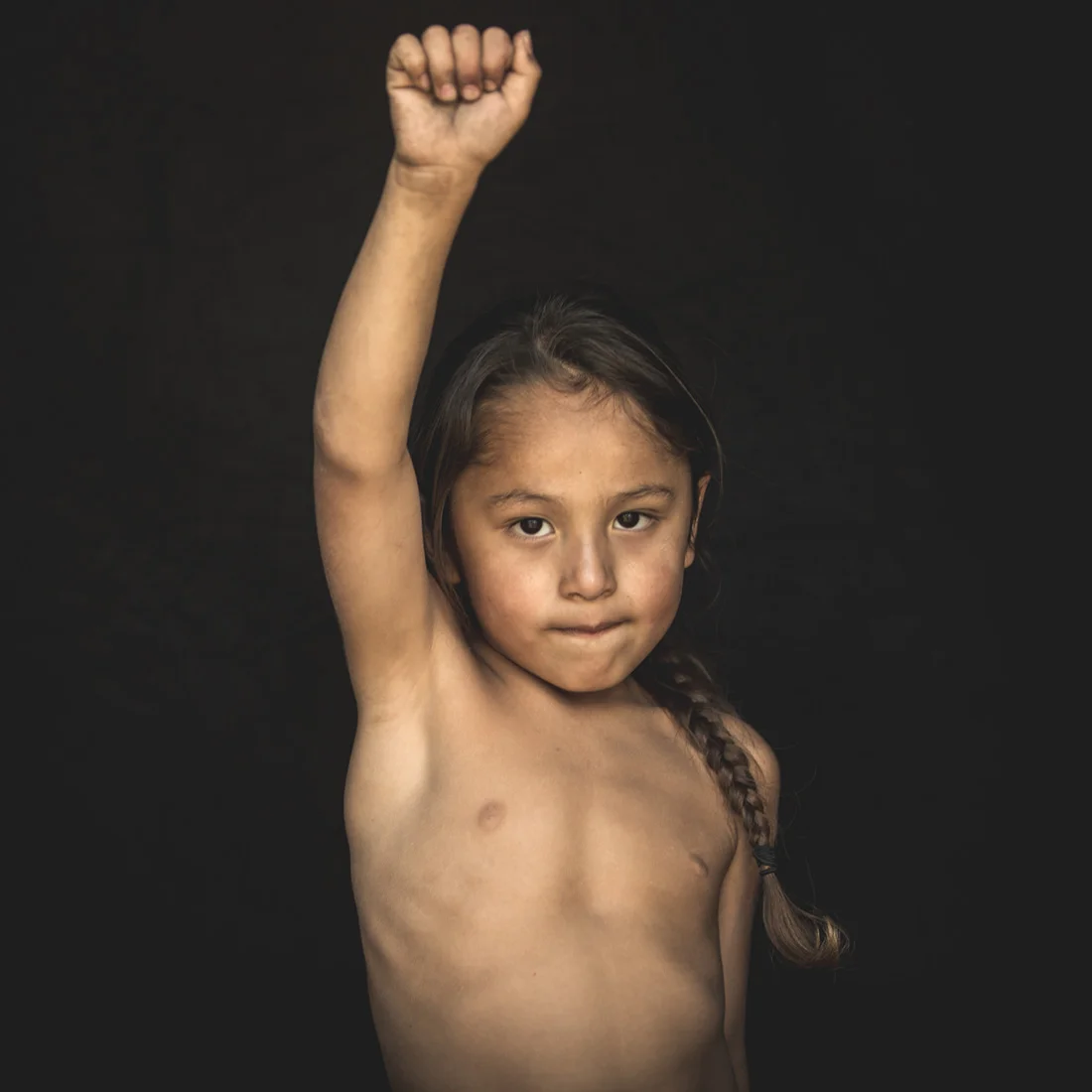 A young boy exhibits the pride and resolve of his Native people at the Standing Rock Reservation in Cannon Ball, North Dakota.