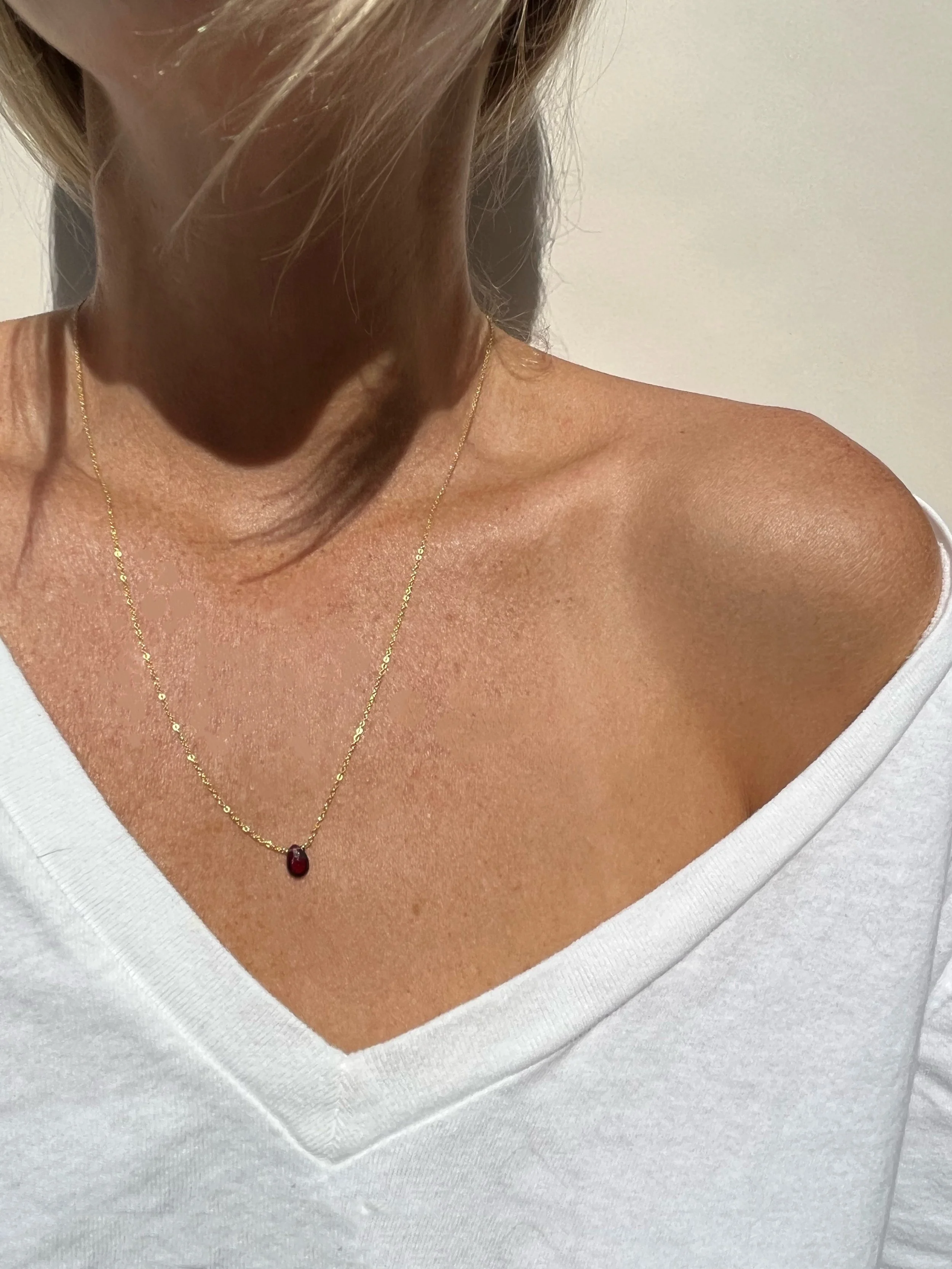 woman wearing minimalist garnet drop necklace | handmade Lafayette necklaces | THALKEN