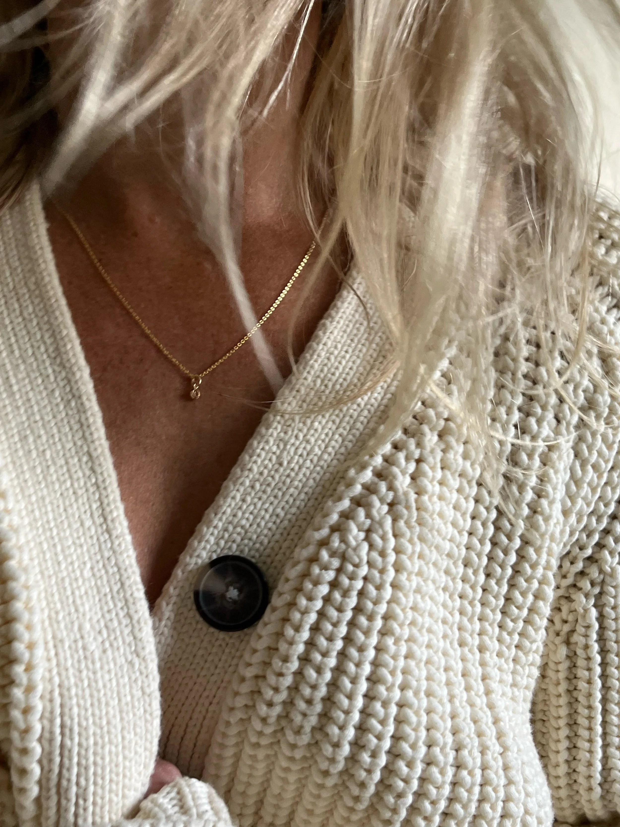 lifestyle shot of woman wearing charm necklace | handmade minimalist jewelry | THALKEN