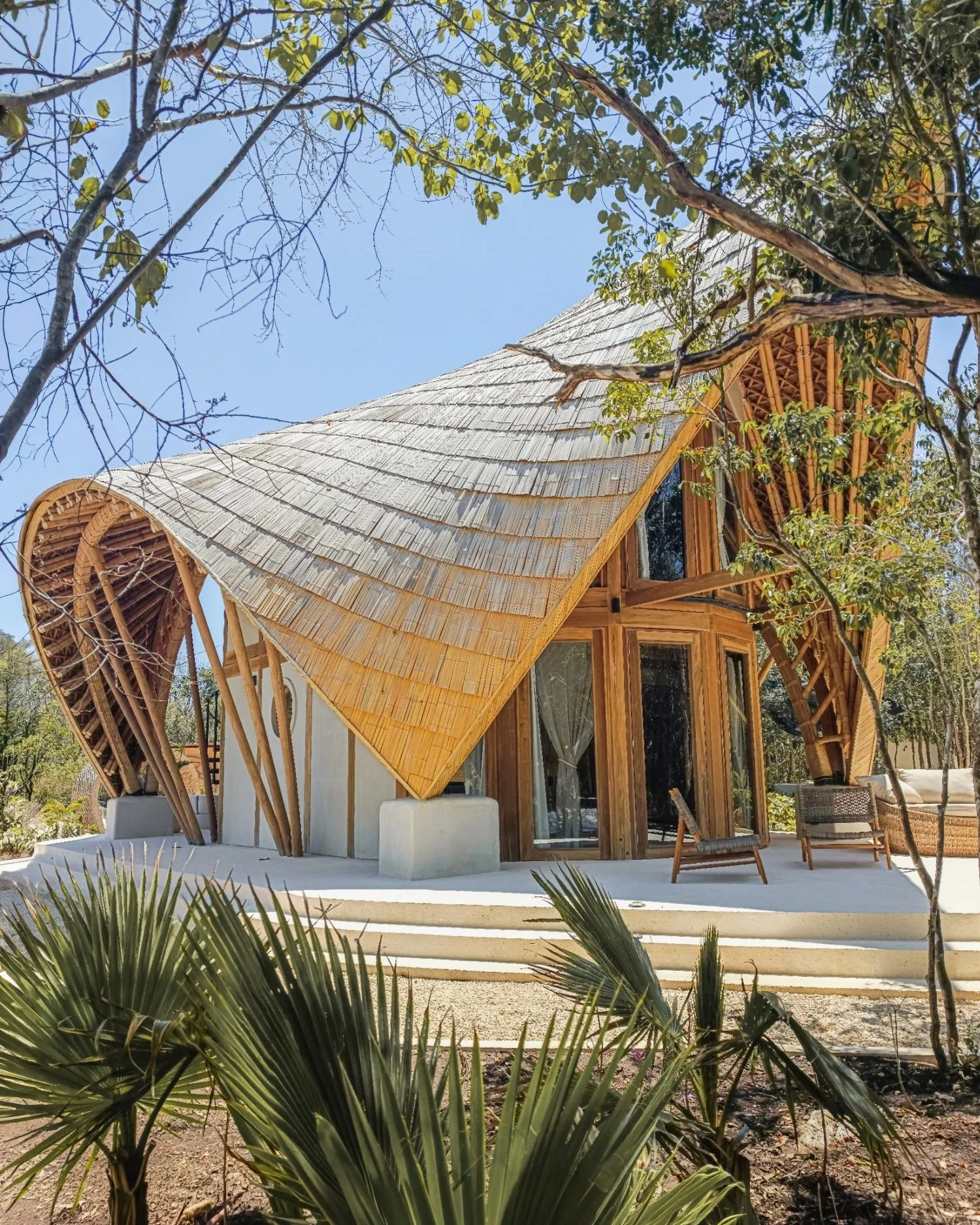 Guadua bamboo pavilion with curved sculptural roof by terrAurea studio — bio-based construction