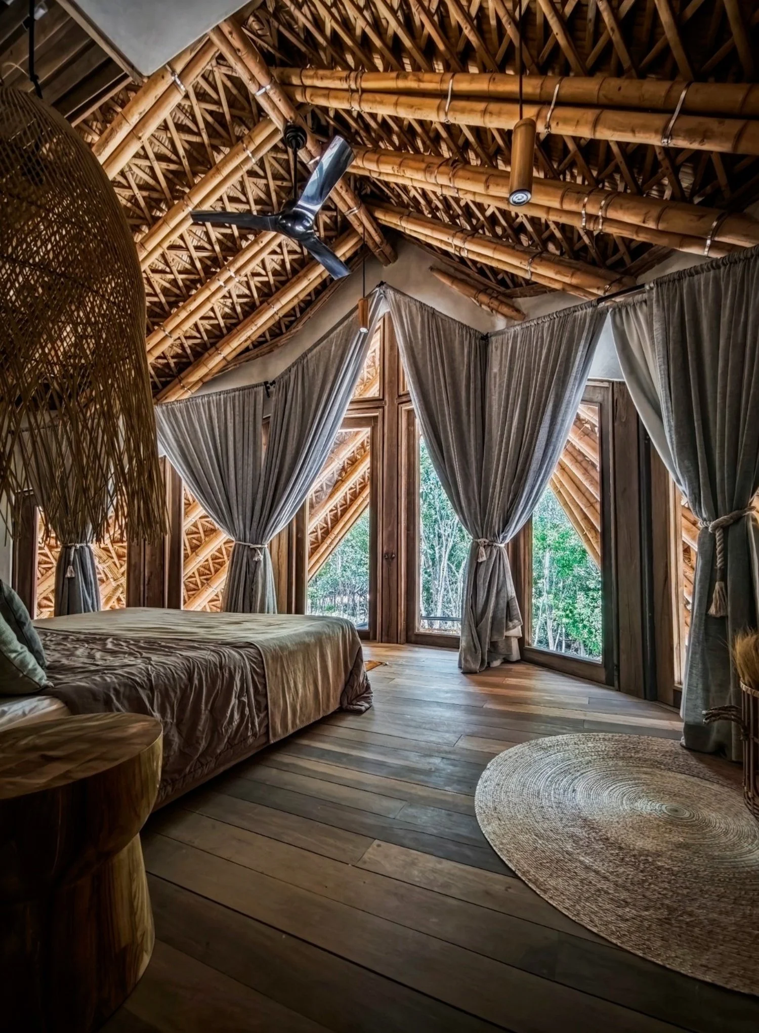 Interior of a Guadua bamboo building by terrAurea studio showing exposed structural frame
