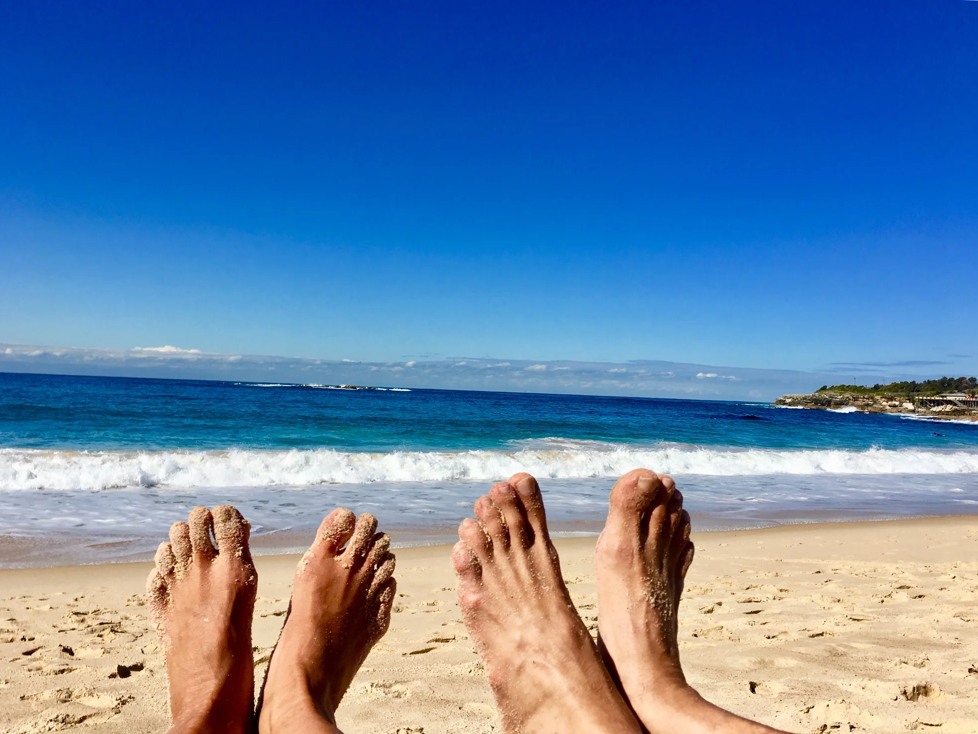 First thing first as we touch the Australian soil. Landing our bare feet on the sand and the ocean at Coogee Beach, Sydney, Australia