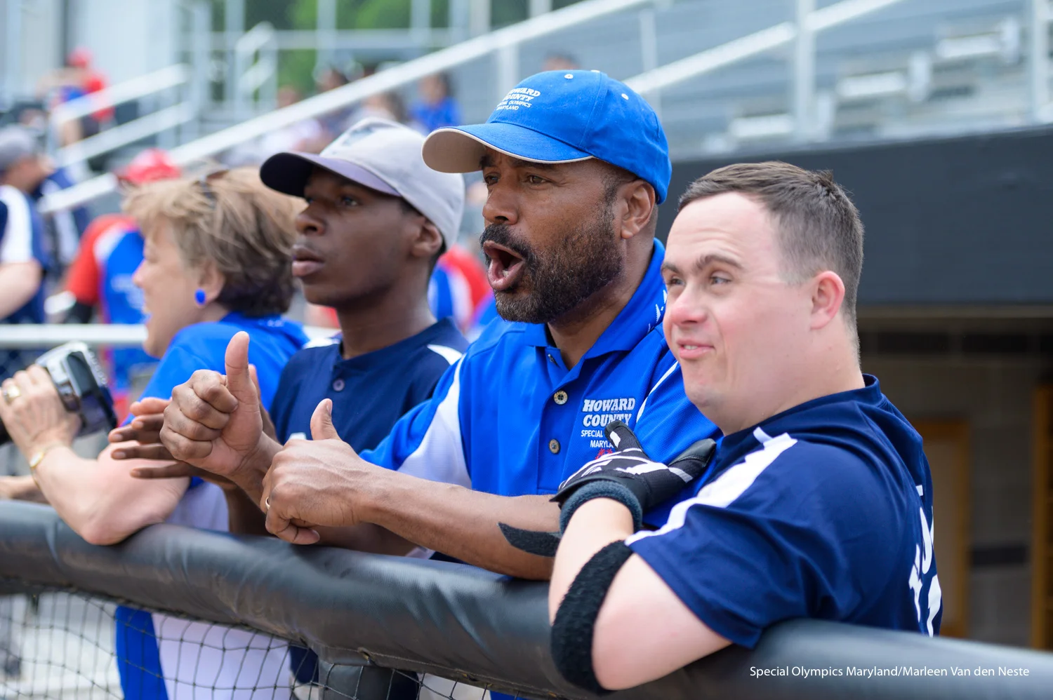 Howard County coaches and athlete watching the game from the sidelines at the Varsity Softball Field at Towson University on Sunday, June 9, 2019.