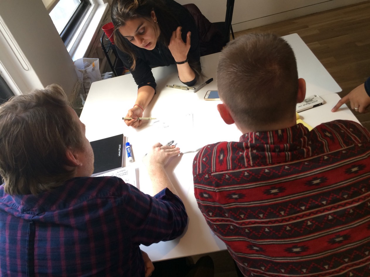 Clockwise from top, Bani, Andrew and I sketch as part of a design studio to find visual solutions to reach our goal.
