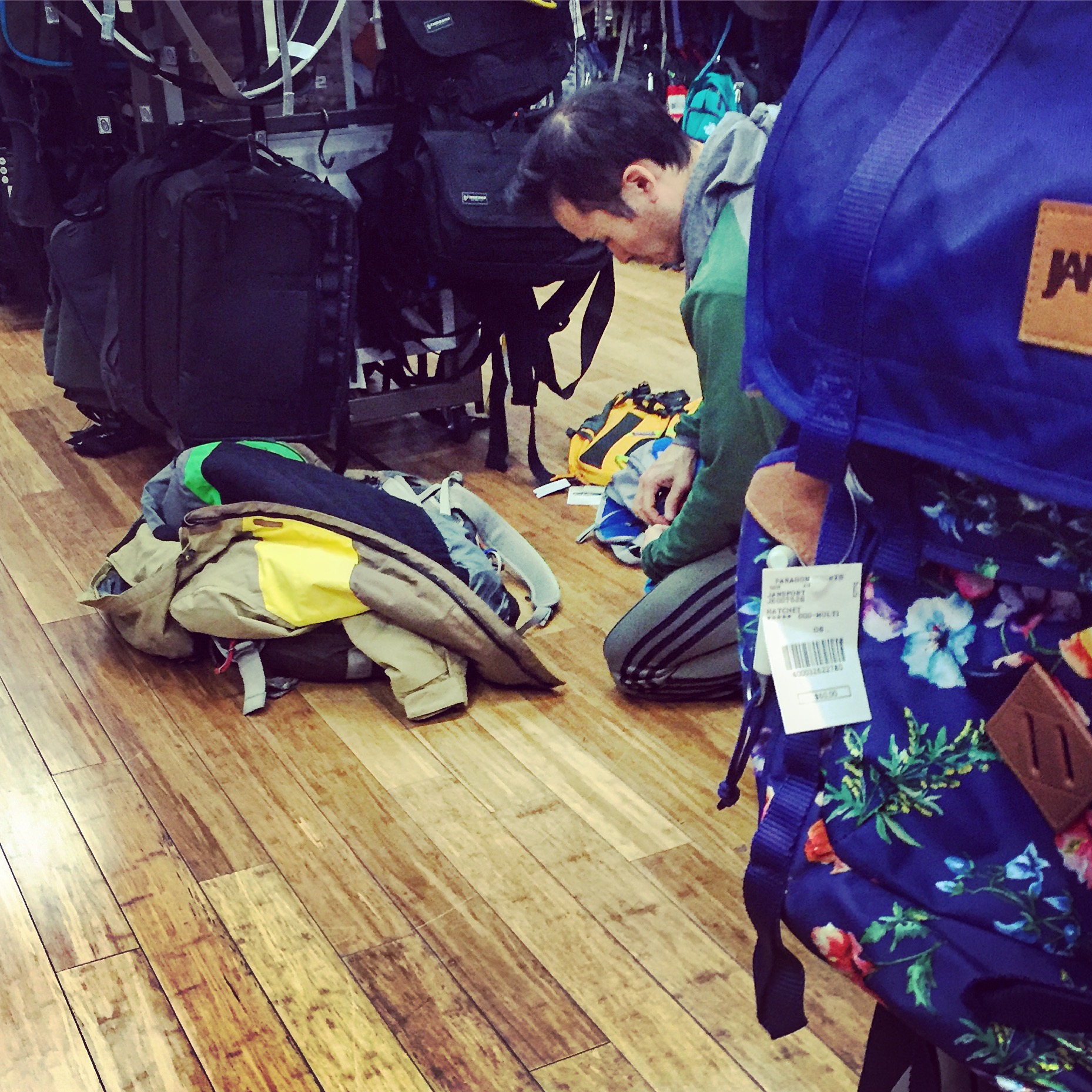 Another customer tests the backpacks.