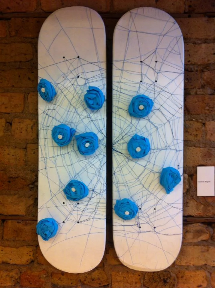 Love Catcher, Blue Roses and Spider Web - Medium: used skateboard, spray paint, thread, crepon paper, buttons - Corinne Séguin (2013)