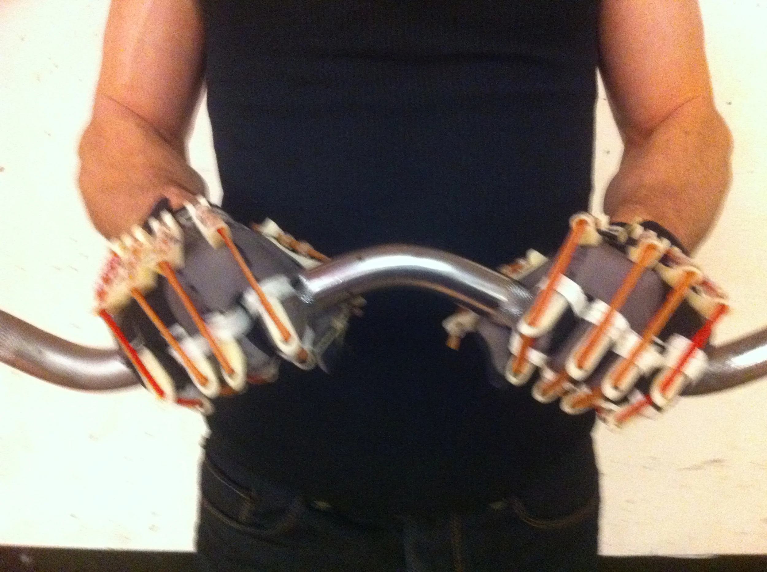  Using a notching system, the user is free to change the resistance in each finger as desired. 