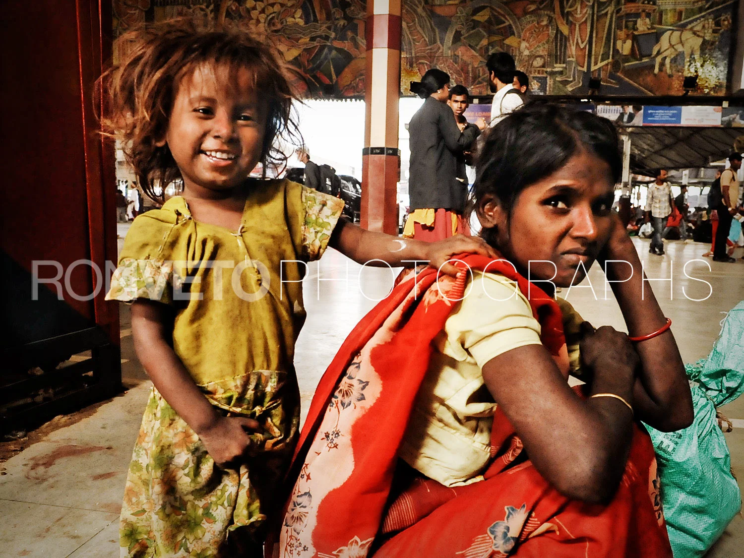 Mother and Daughter at train station, New Delhi, India