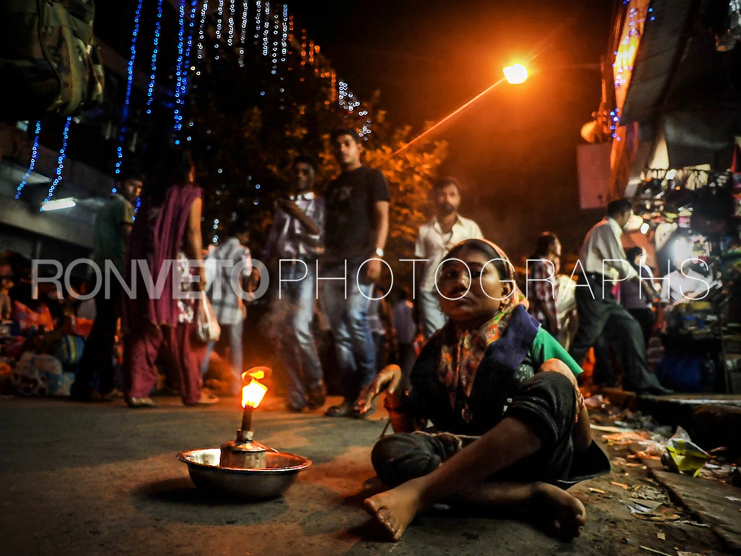 Woman with candle, Calcutta, India