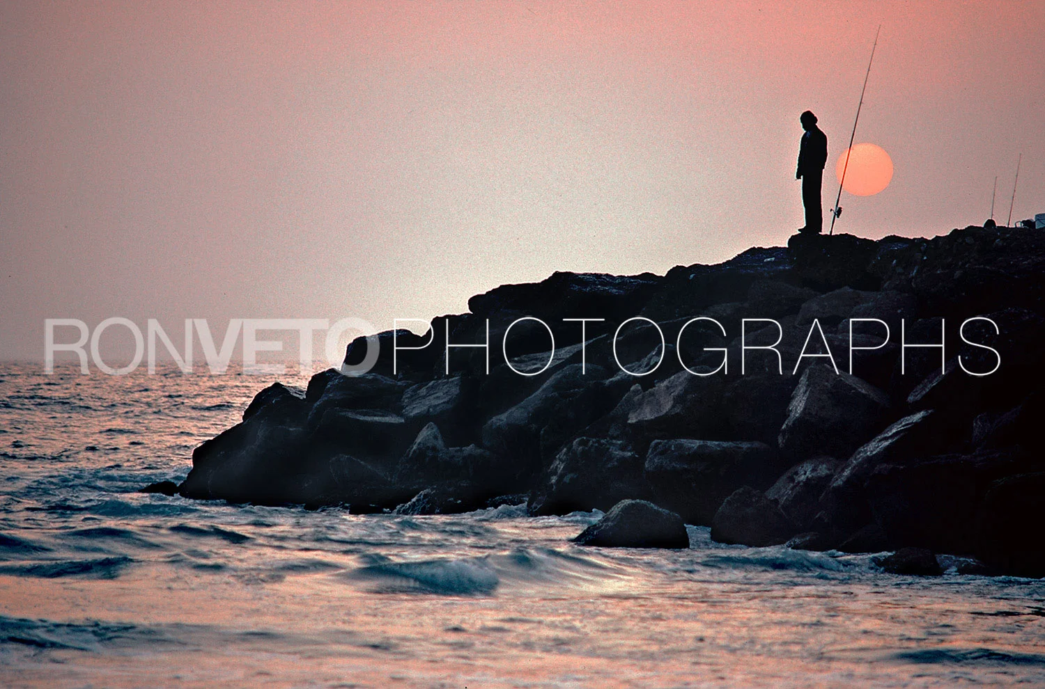 Fishing at Venice rocks, Venice Beach, Ca.