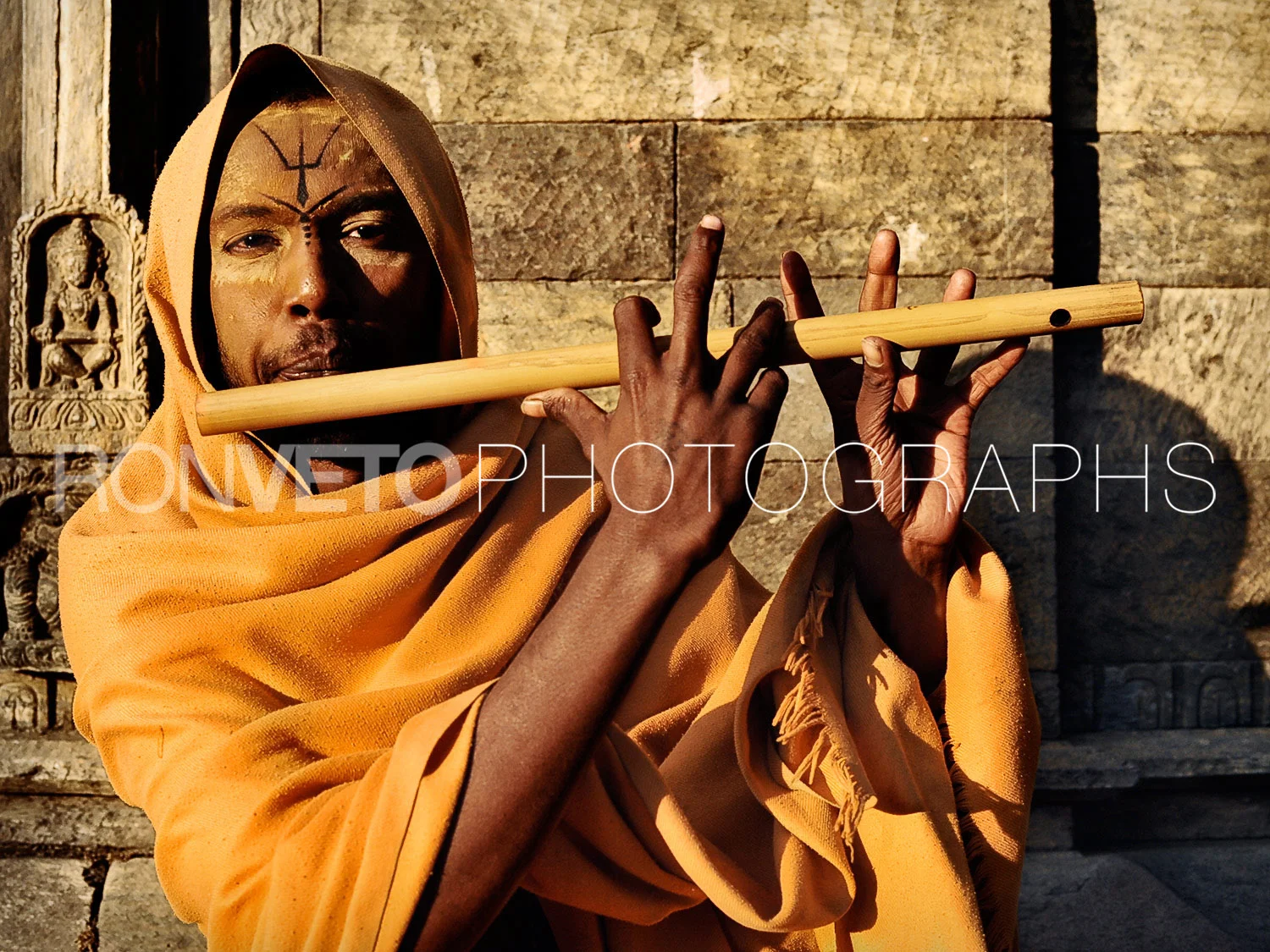 Holyman playing flute, Kathmandu, Nepal