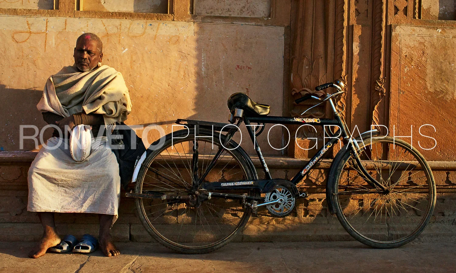 Man with bike at Temple. Vrindavan, India