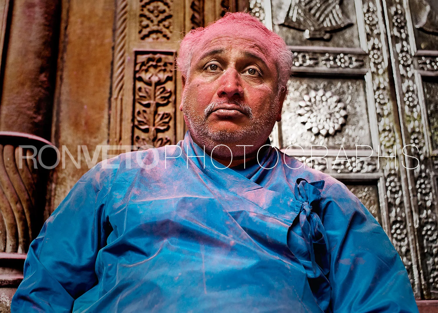 Man outside of the temple at Holi, India
