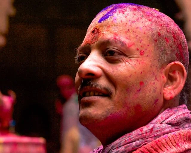 smiling man holi india