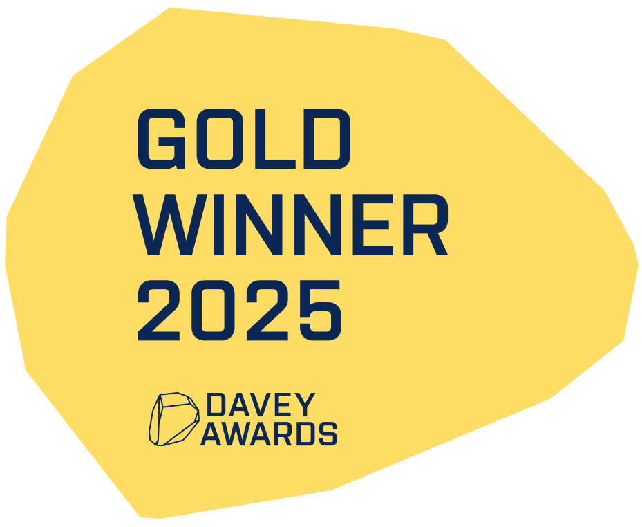 A yellow, irregular-shaped badge with dark blue text that reads "GOLD WINNER 2025 DAVEY AWARDS" and a small graphic of a gemstone.
