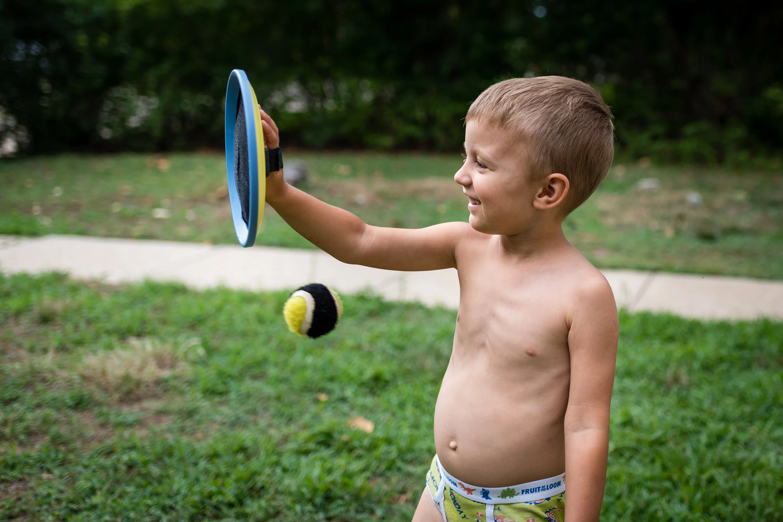We had a family gathering in Manhattan, Kansas this summer. We had an awesome time and made many memories! Nothing better than being with family. I took many great photos from the six days we were together, but this one puts a smile on my face. Sharon was playing catch with Benaiah with this "old school" velcro disc and ball. Benaiah could catch the ball as long as Sharon threw it right at his disc. If not, the ball would hit him. This picture reminds me that life is filled with bumps, bruises and surprises. Benaiah has so much to learn. But with skill, practice and experience, he will learn to handle the challenges that life tosses at him.