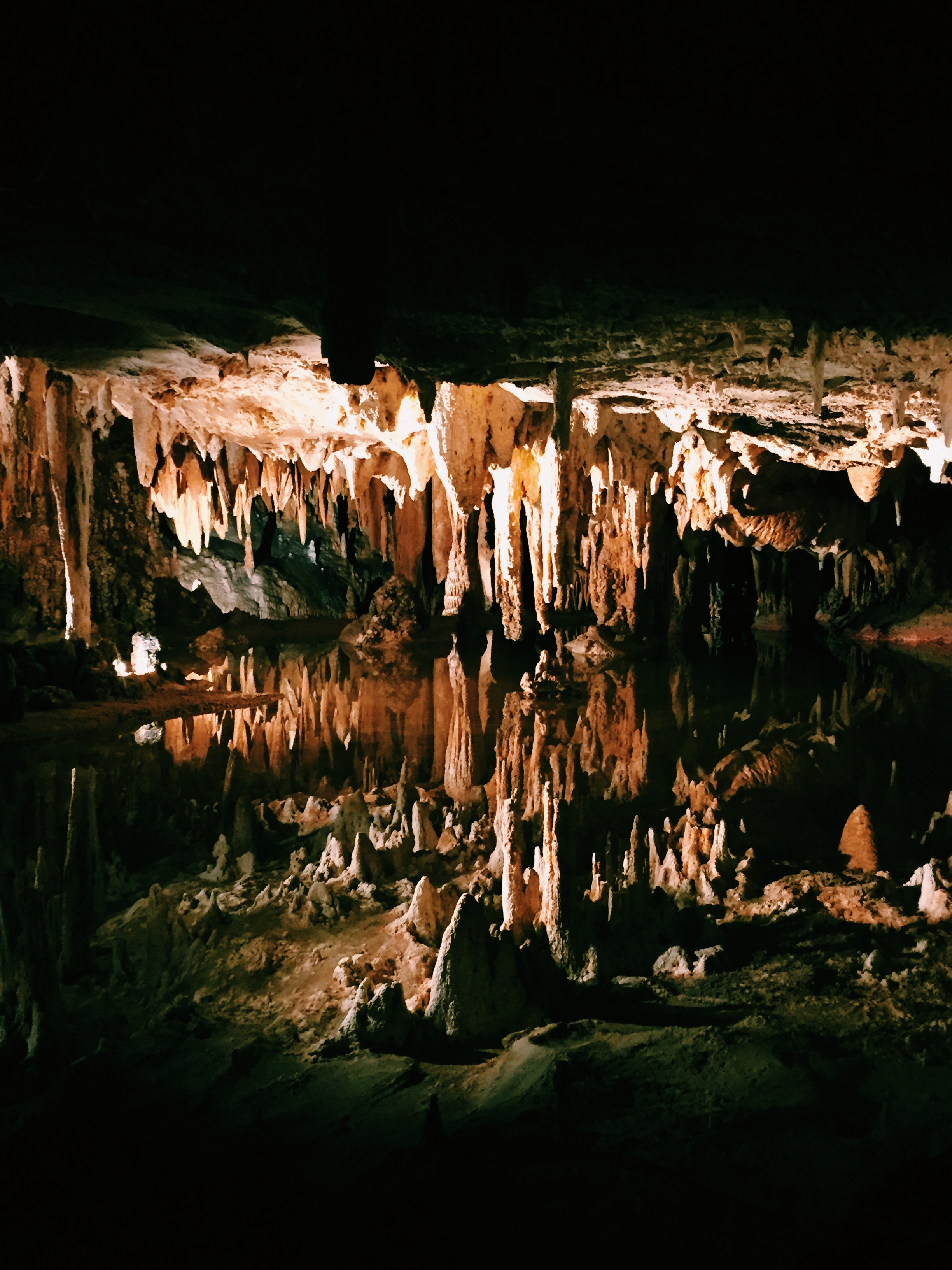 This is an active cavern -meaning it is not dry- meaning it has water. This was a lake. The bottom half of this photo is the reflection in the lake. mind blown.