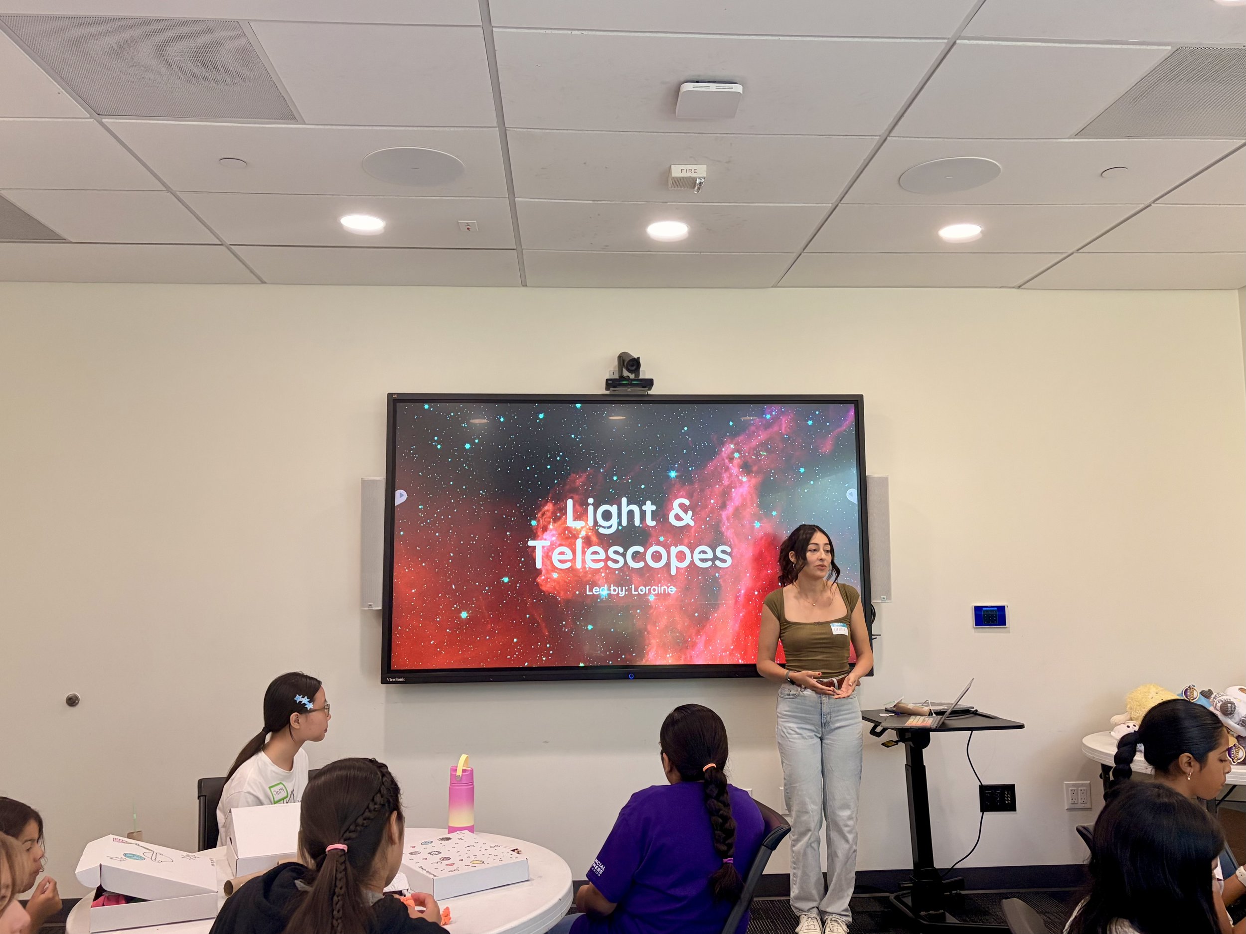 Learning about light and telescopes with Facilitator Loraine