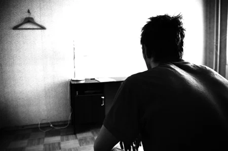 Sitting and staring at a wall