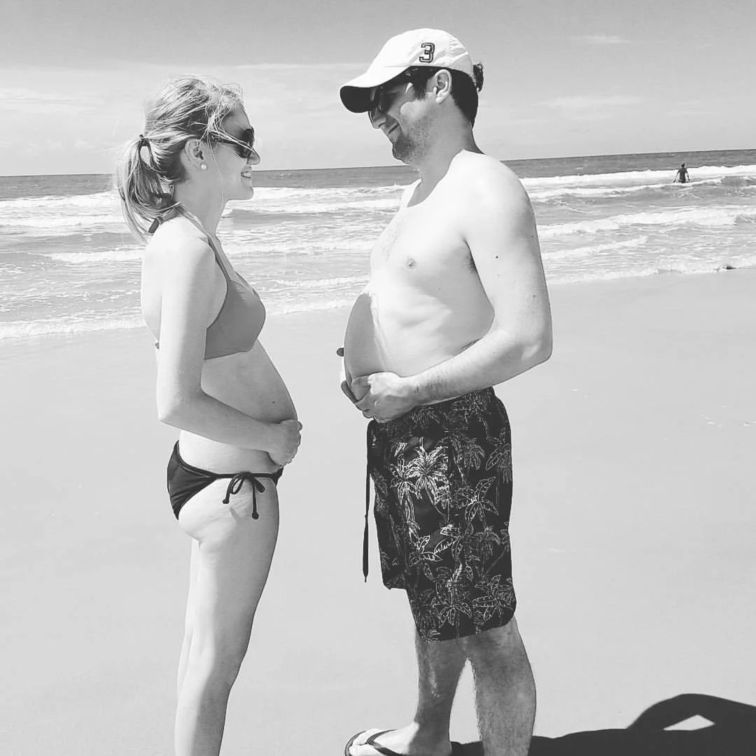 Comparing belly bumps. Thanks to queso and pizza, I'm maintaining my lead at the moment. 