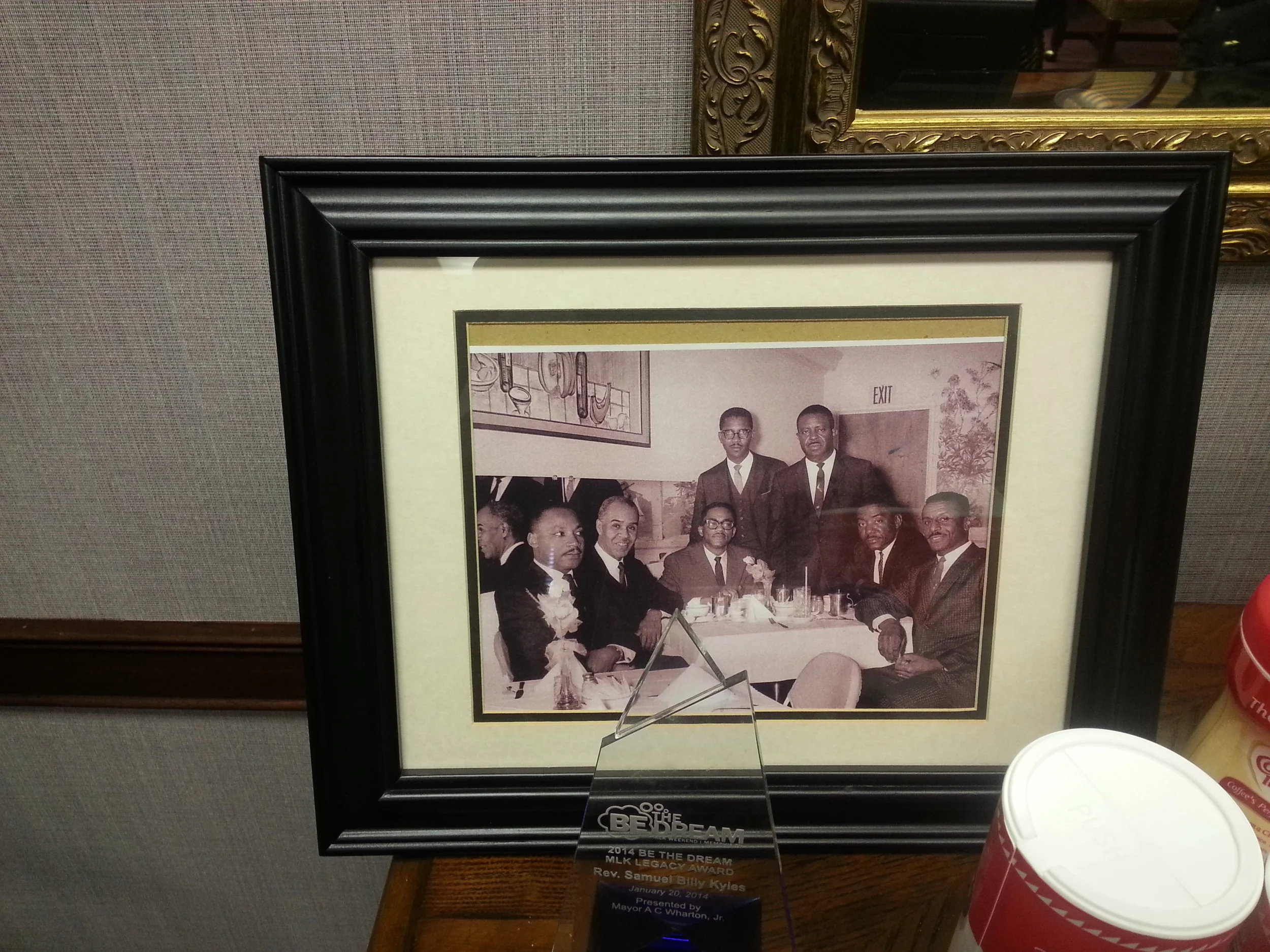 Historic photo of Reverend Samuel "Billy" Kyles, Dr. Martin Luther King Jr. and other luminaries featured in Rev. Kyles's office at Monumental Baptist Church in Memphis. Photo by Vincent L. Stephens.