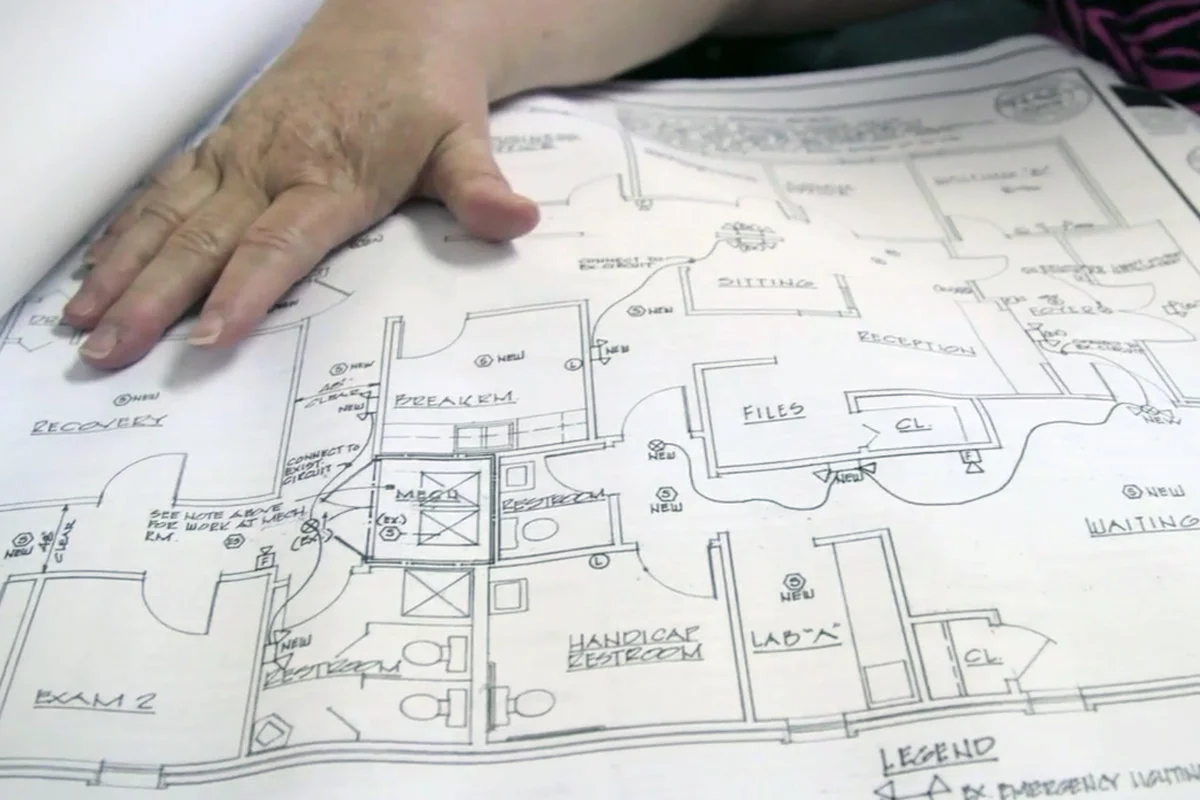 June Ayers, co-owner of Reproductive Health Services in Montgomery, Ala. displays blueprints for changes to her clinic that are necessary to adhere to new state guidelines.
