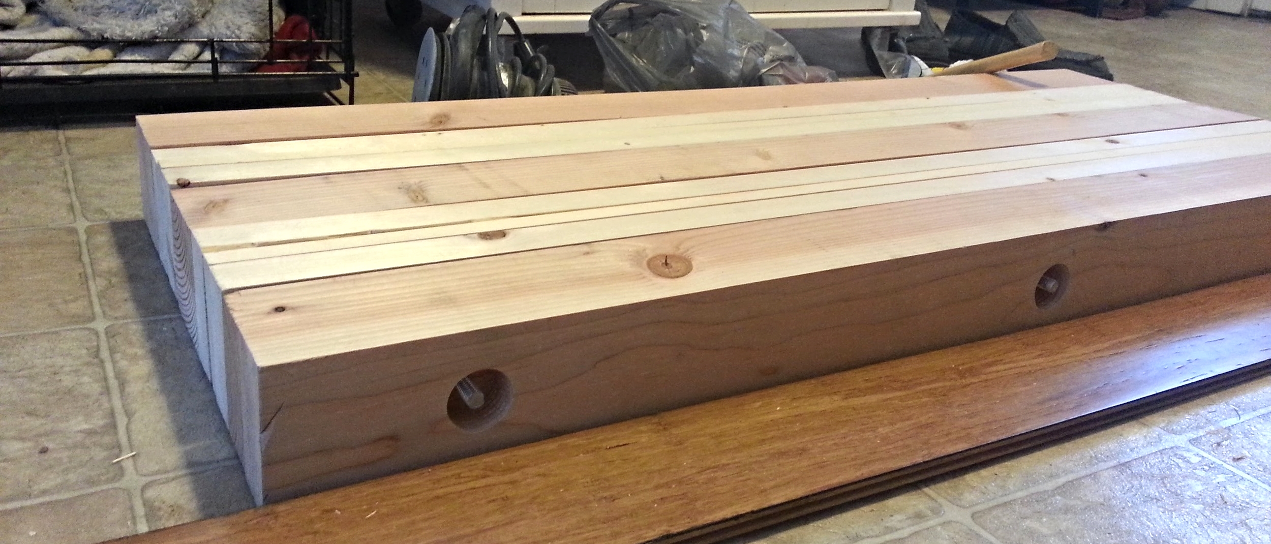 Here's the threaded bar that runs through the laminate stack. We used a Forstner bit to countersink the ends so that washers would fit inside the recessed area.