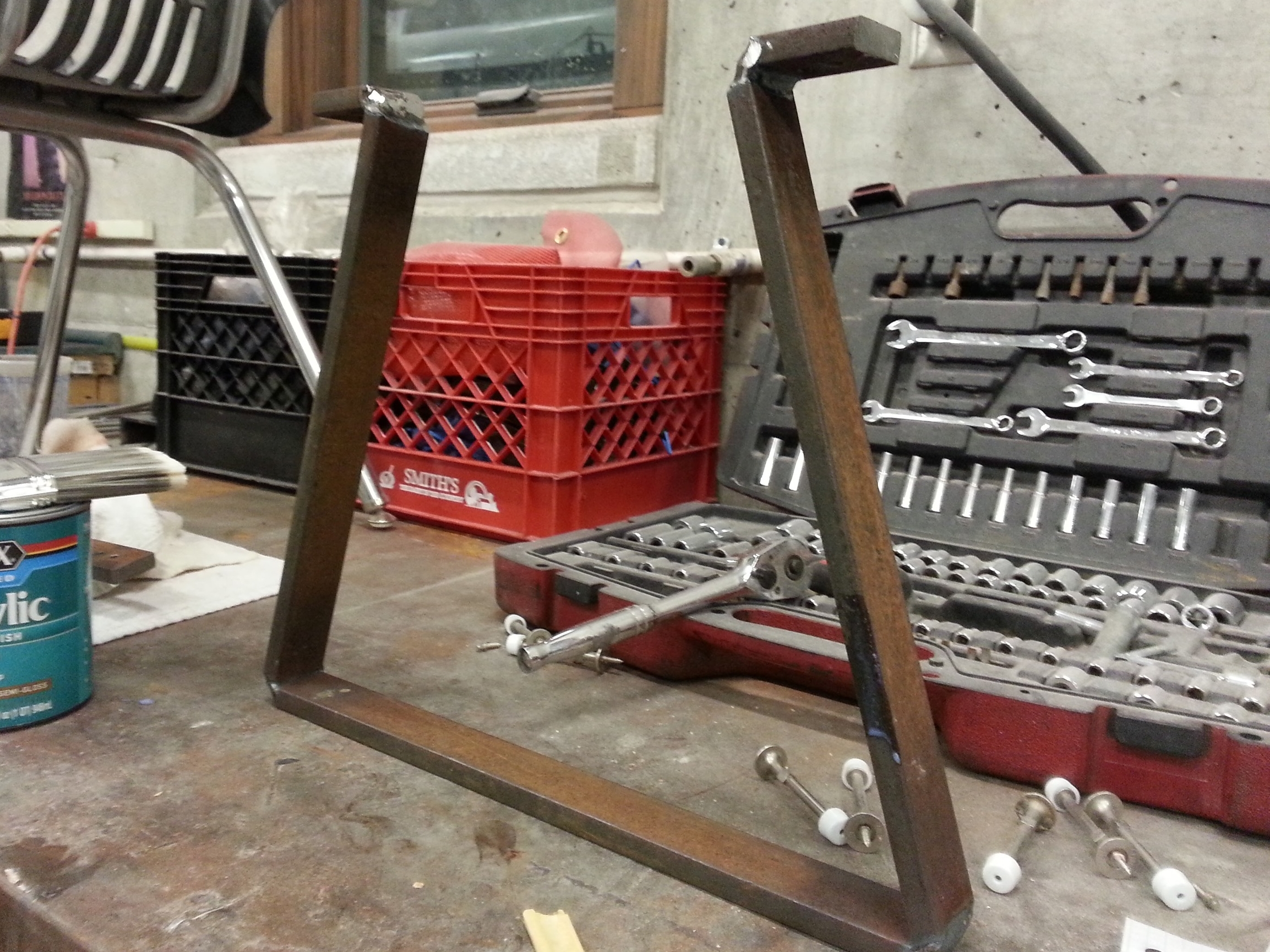 One leg, bent into the desired shape, with the joints fillet welded for reinforcement