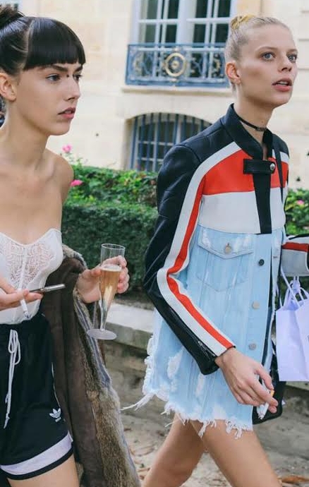Kye Howell in Adidas shorts and Lexi Boling in an Alexander Wang jacket