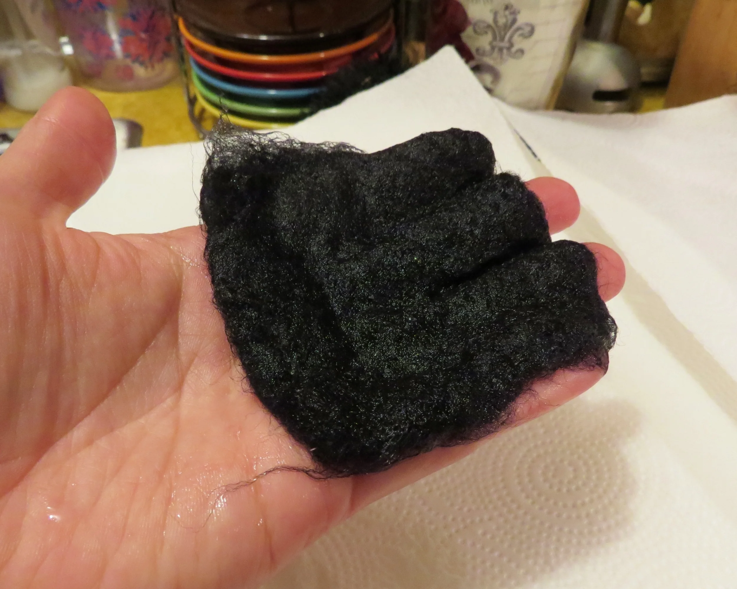 8. Gently run hot water over the wool -- as hot as your fingers can stand!