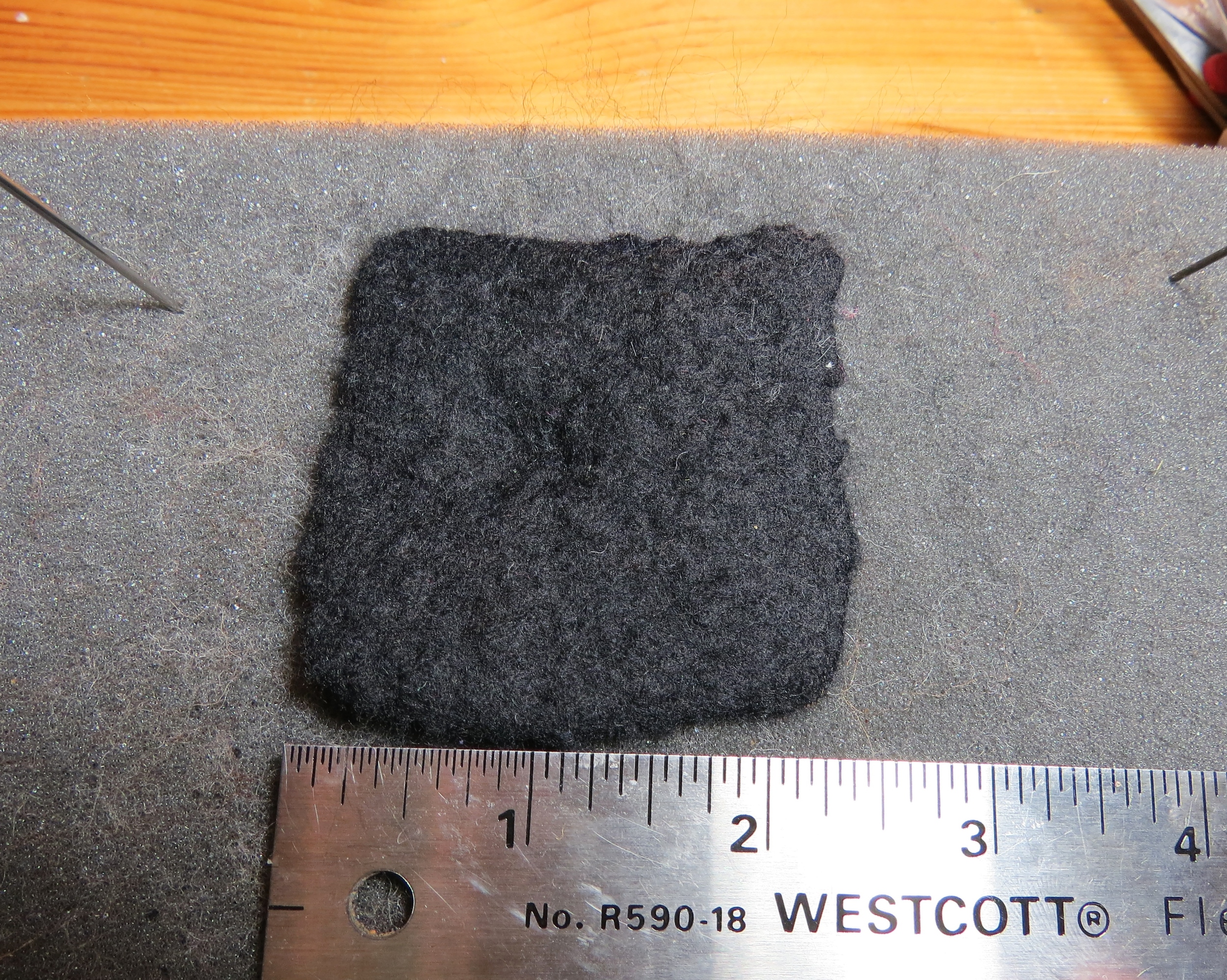 13. Ta-daaah! The finished piece, ready to be made into cat ears. Notice that it's an inch smaller than it used to be, and very densely felted and smooth.
